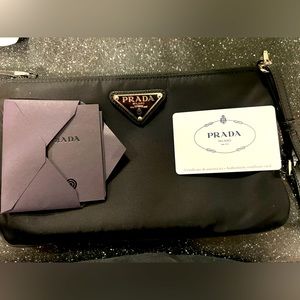 Prada black logo plaque pouch.